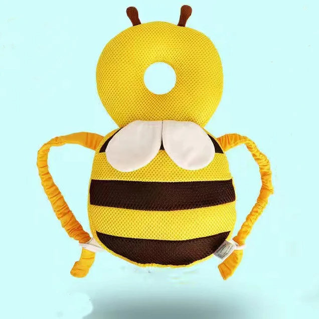 Coussin anti tête plate en forme d'abeille ici sur un fond bleu.